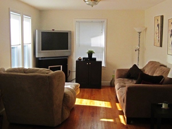 139 Linden Street, Unit 2 Wellesley, MA 02482 - Photo 4 of 9 a living room with furniture and a flat screen tv