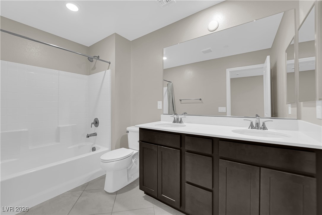 2606 Ercolano Street Henderson, NV 89044 - Photo 24 of 46 Primary bath w/espresso cabinets, quartz counters, dual sinks and sep tub & shower.