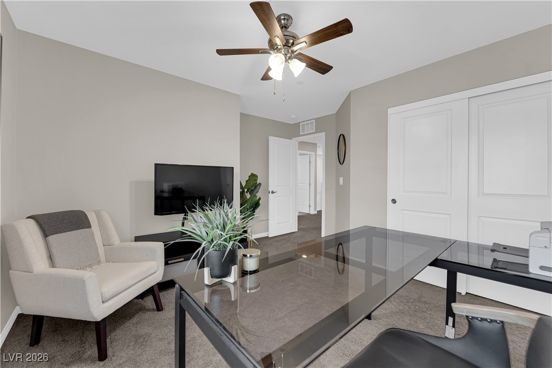 2606 Ercolano Street Henderson, NV 89044 - Photo 27 of 46 Bed 2 w/ceiling fan & light, two tone paint, curtains & closet.
