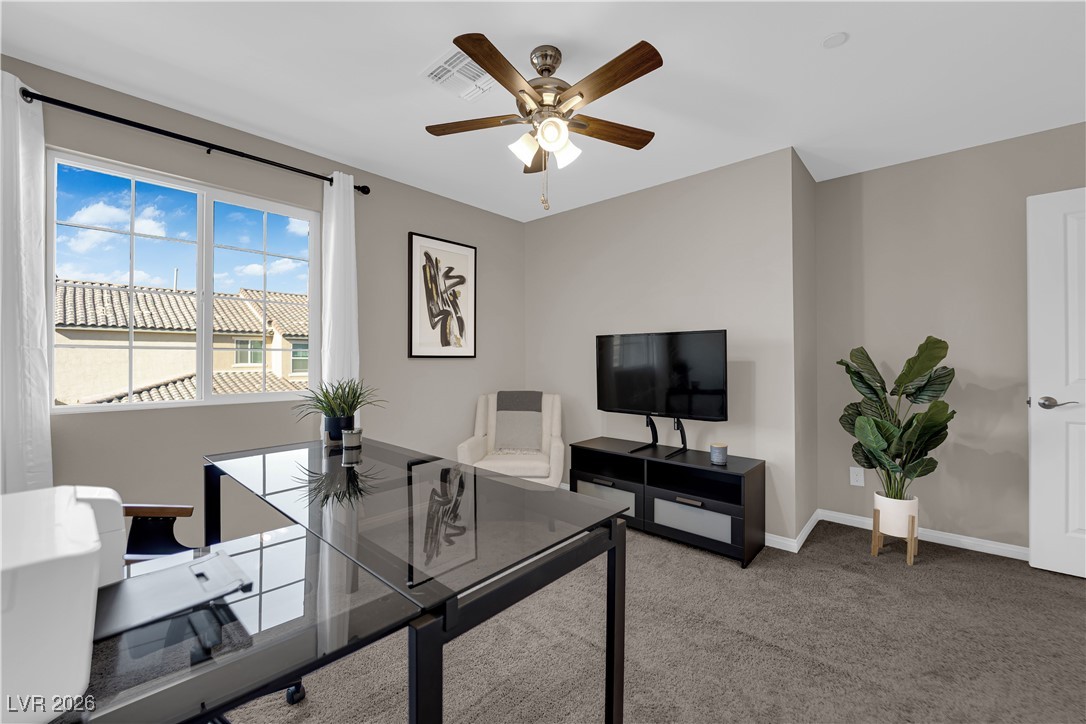 2606 Ercolano Street Henderson, NV 89044 - Photo 28 of 46 Bed 2 w/ceiling fan & light, two tone paint, curtains & closet.