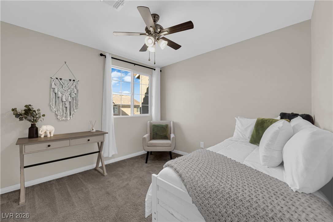 2606 Ercolano Street Henderson, NV 89044 - Photo 31 of 46 Bed 3 w/ceiling fan & light, two tone paint, curtains & closet.