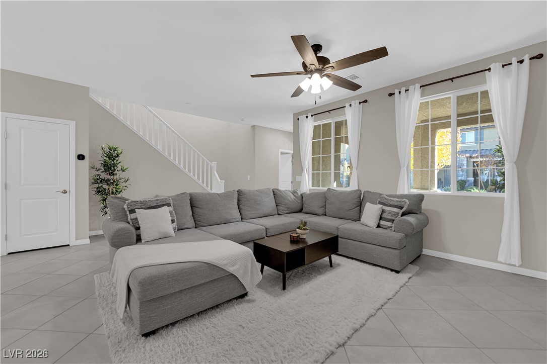 2606 Ercolano Street Henderson, NV 89044 - Photo 8 of 46 Great room w/ceiling fan & light, tile floors & two tone paint.