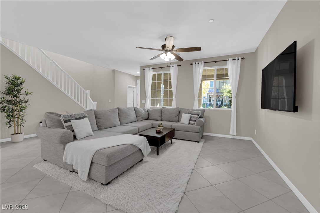 2606 Ercolano Street Henderson, NV 89044 - Photo 9 of 46 Great room w/ceiling fan & light, tile floors & two tone paint.