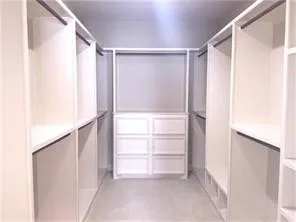 a view of an empty walk in closet