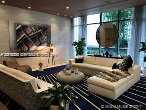 55 Southwest 9th Street, Unit 2504 Miami, FL 33130 - Photo 16 of 29 a living room with furniture and a mirror