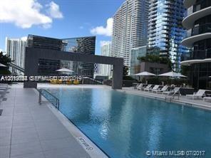 55 Southwest 9th Street, Unit 2504 Miami, FL 33130 - Photo 27 of 29 a view of a swimming pool with outdoor seating