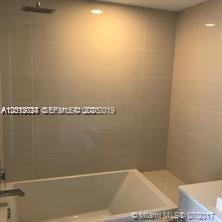 55 Southwest 9th Street, Unit 2504 Miami, FL 33130 - Photo 8 of 29 a view of a bathtub in bathroom