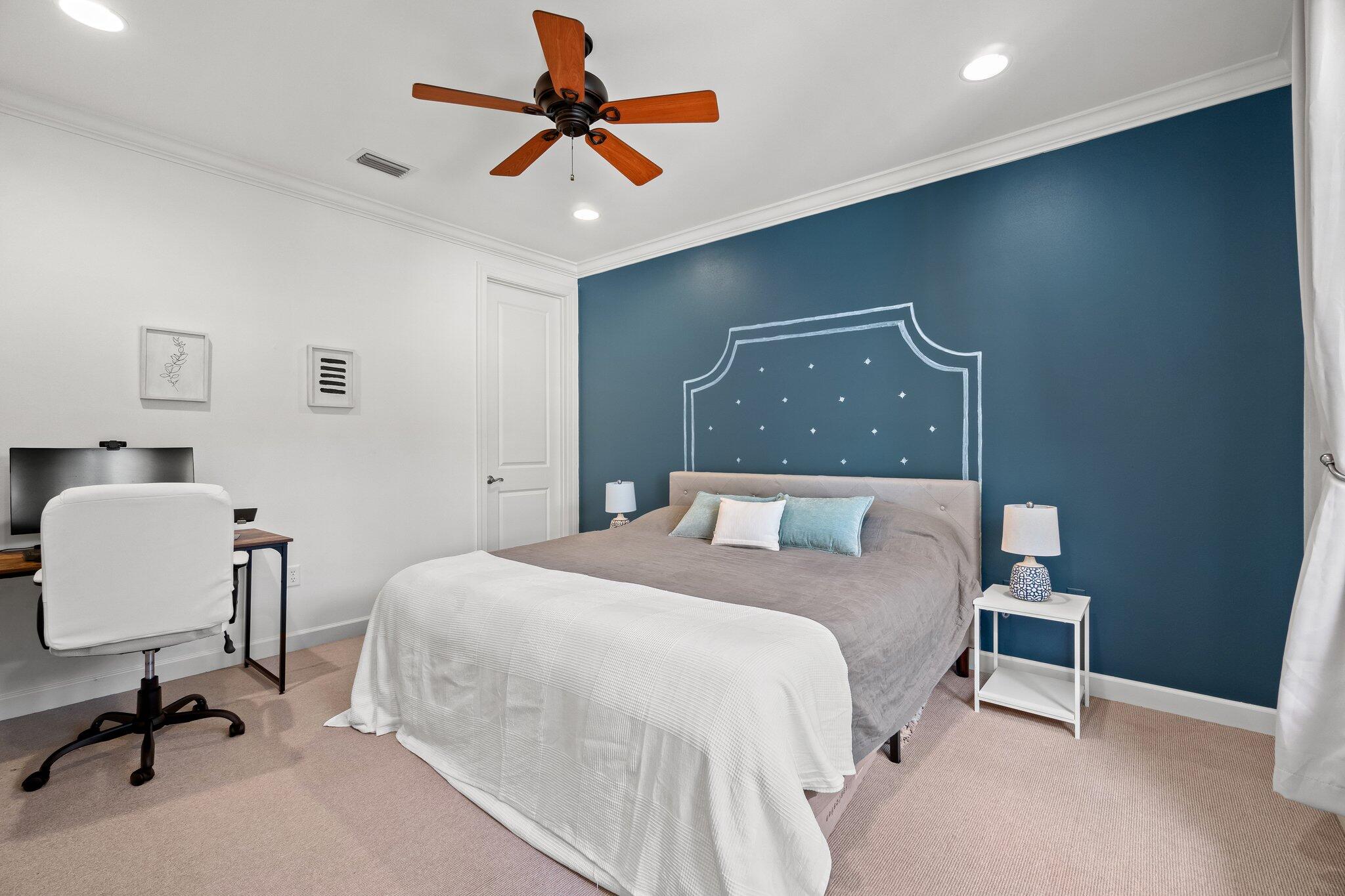 124 East Wild Blueberry Way Santa Rosa Beach, FL 32459 - Photo 14 of 38 a bedroom with a bed a desk and chair