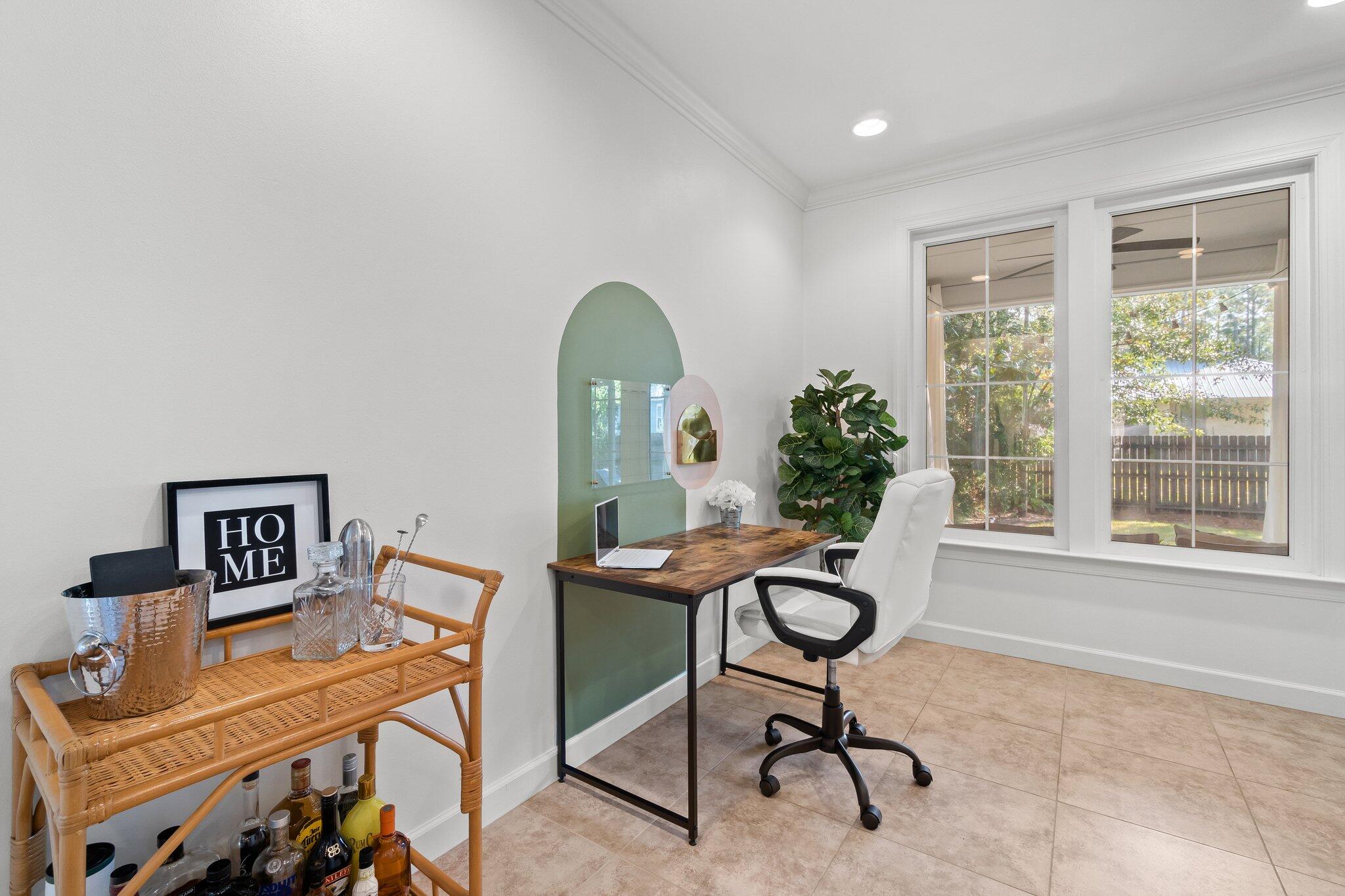 124 East Wild Blueberry Way Santa Rosa Beach, FL 32459 - Photo 18 of 38 a workspace with furniture and a potted plant
