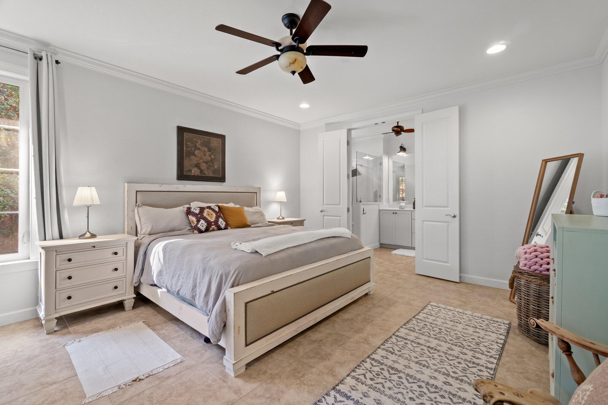 124 East Wild Blueberry Way Santa Rosa Beach, FL 32459 - Photo 19 of 38 a bedroom with a bed and a chair