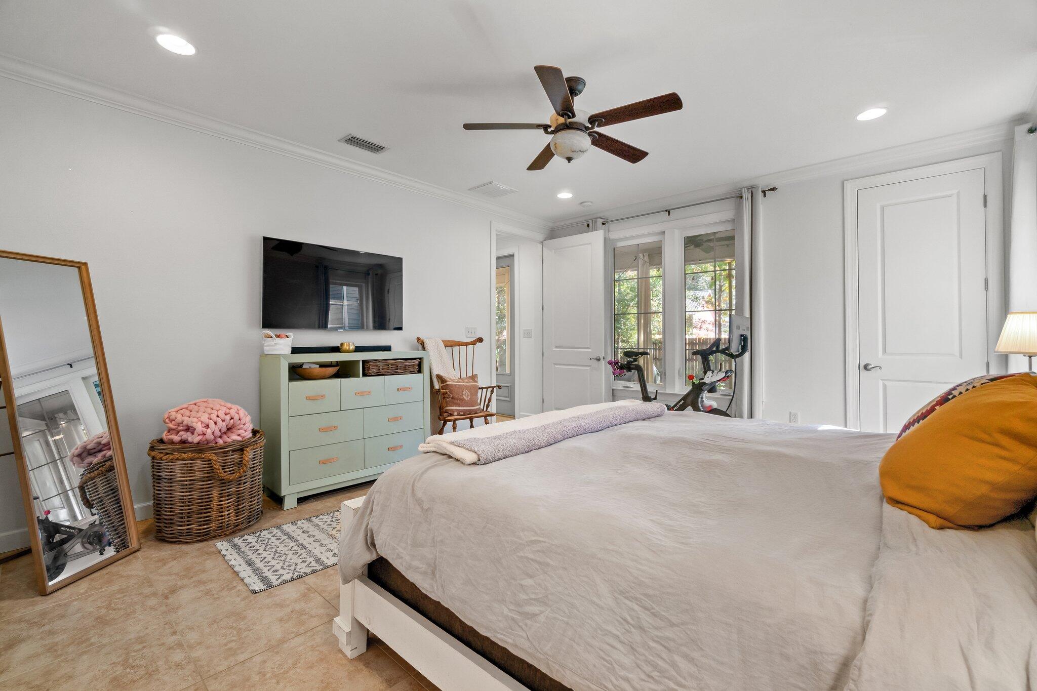 124 East Wild Blueberry Way Santa Rosa Beach, FL 32459 - Photo 20 of 38 a bedroom with a bed a television and dresser
