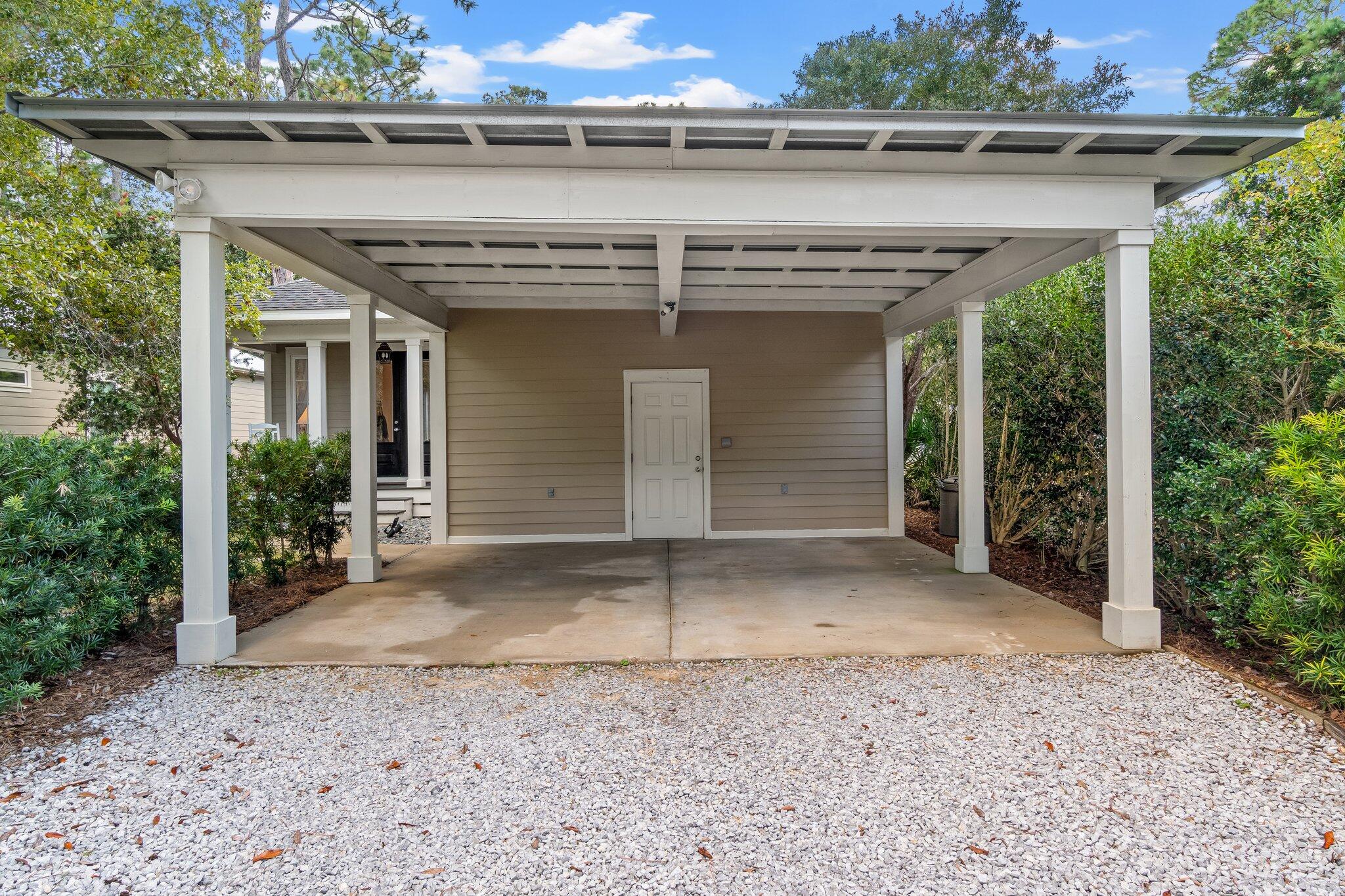124 East Wild Blueberry Way Santa Rosa Beach, FL 32459 - Photo 23 of 38 a view of a entrance gate of the house