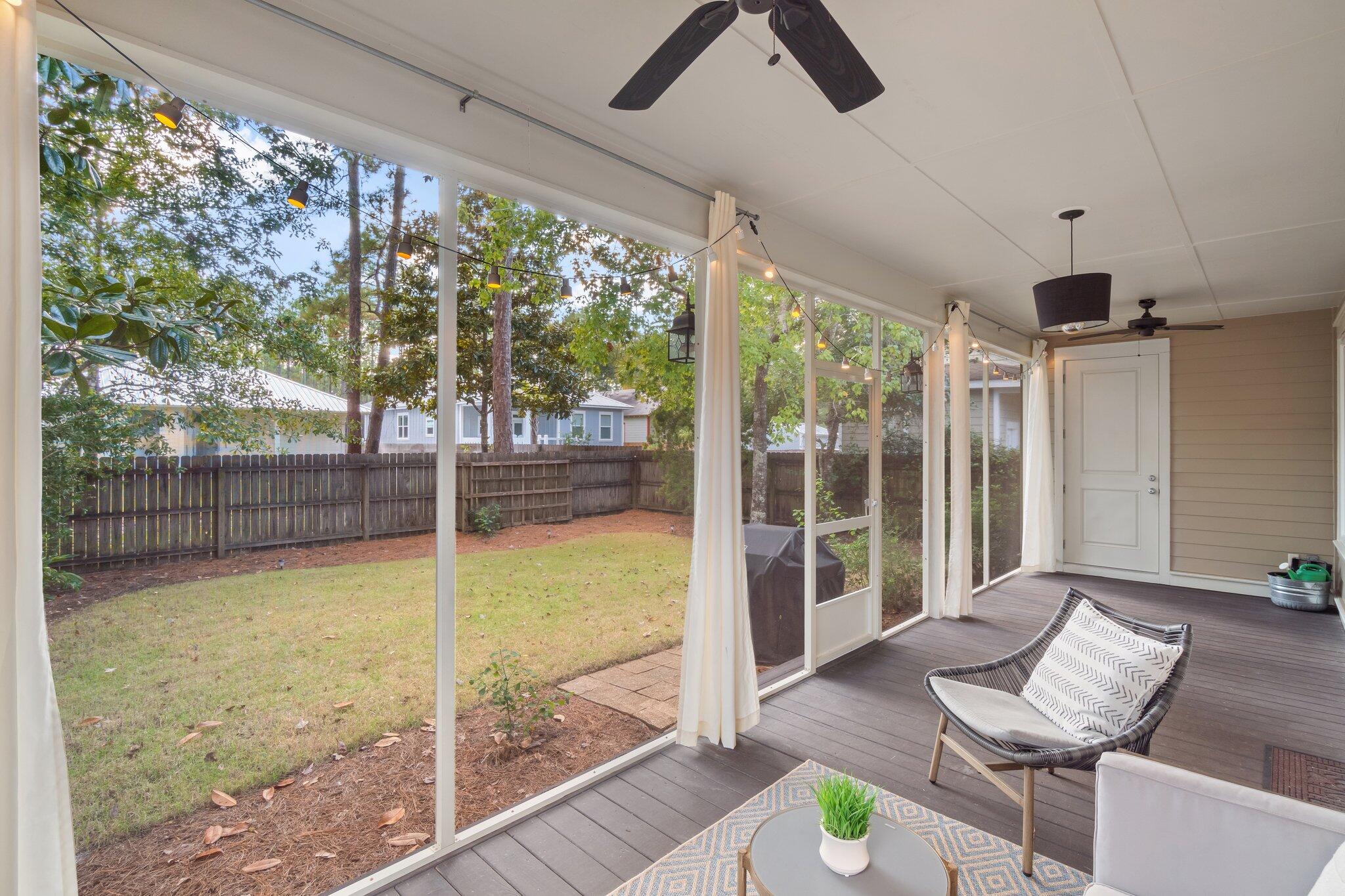 124 East Wild Blueberry Way Santa Rosa Beach, FL 32459 - Photo 27 of 38 a living room with hardwood floor and furniture