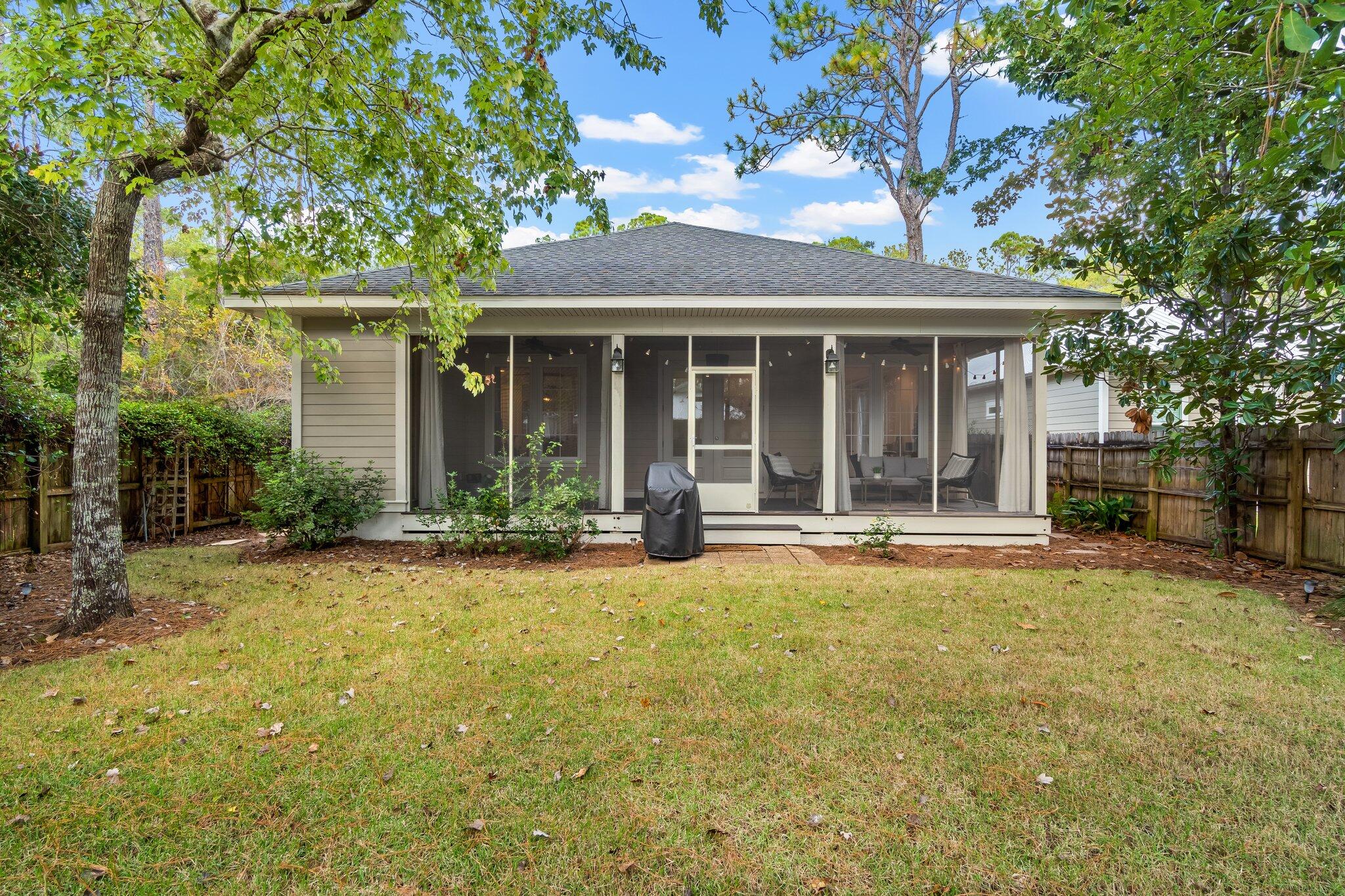 124 East Wild Blueberry Way Santa Rosa Beach, FL 32459 - Photo 30 of 38 front view of a house with a large tree