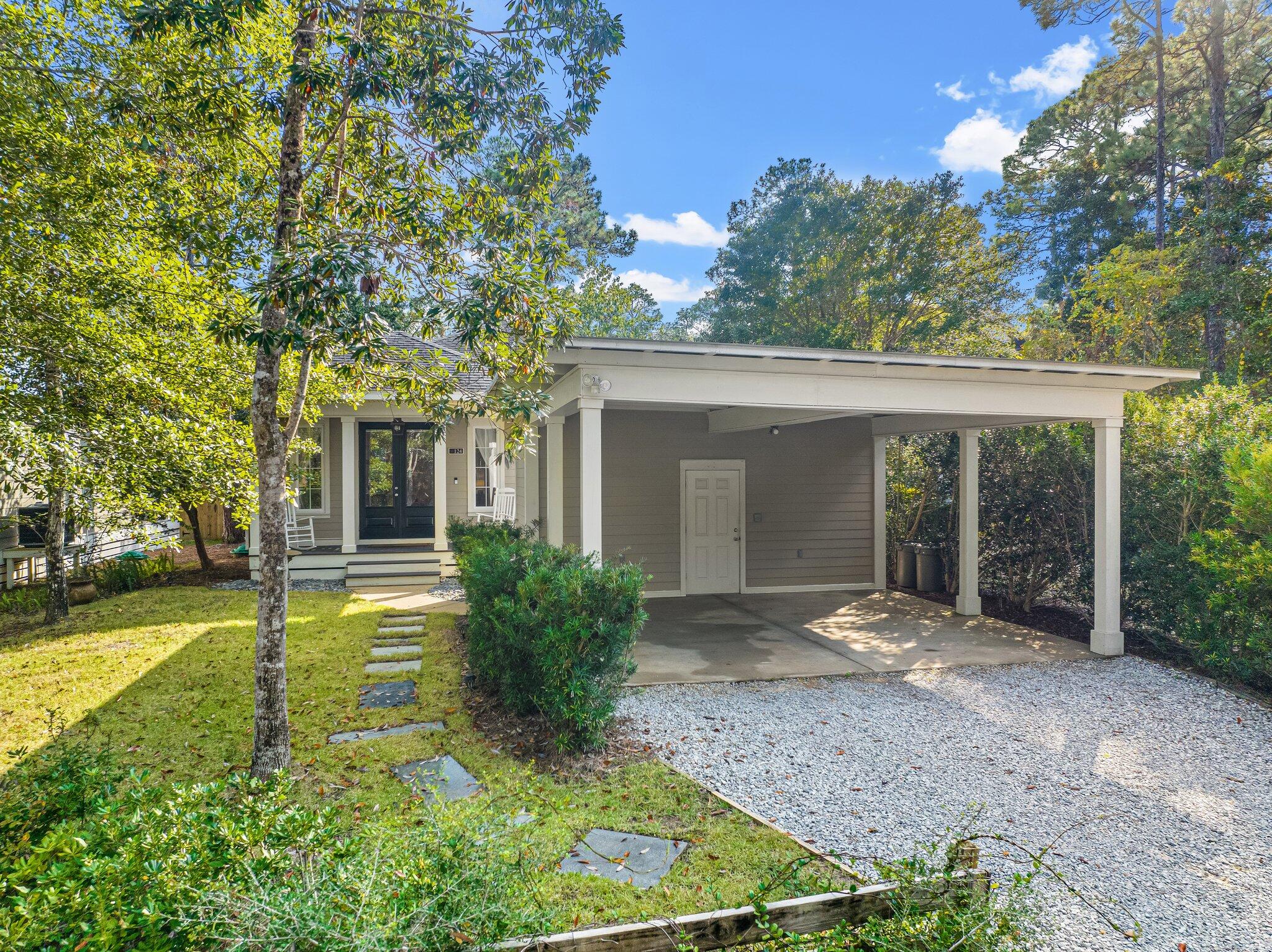 124 East Wild Blueberry Way Santa Rosa Beach, FL 32459 - Photo 31 of 38 front view of a house with a yard