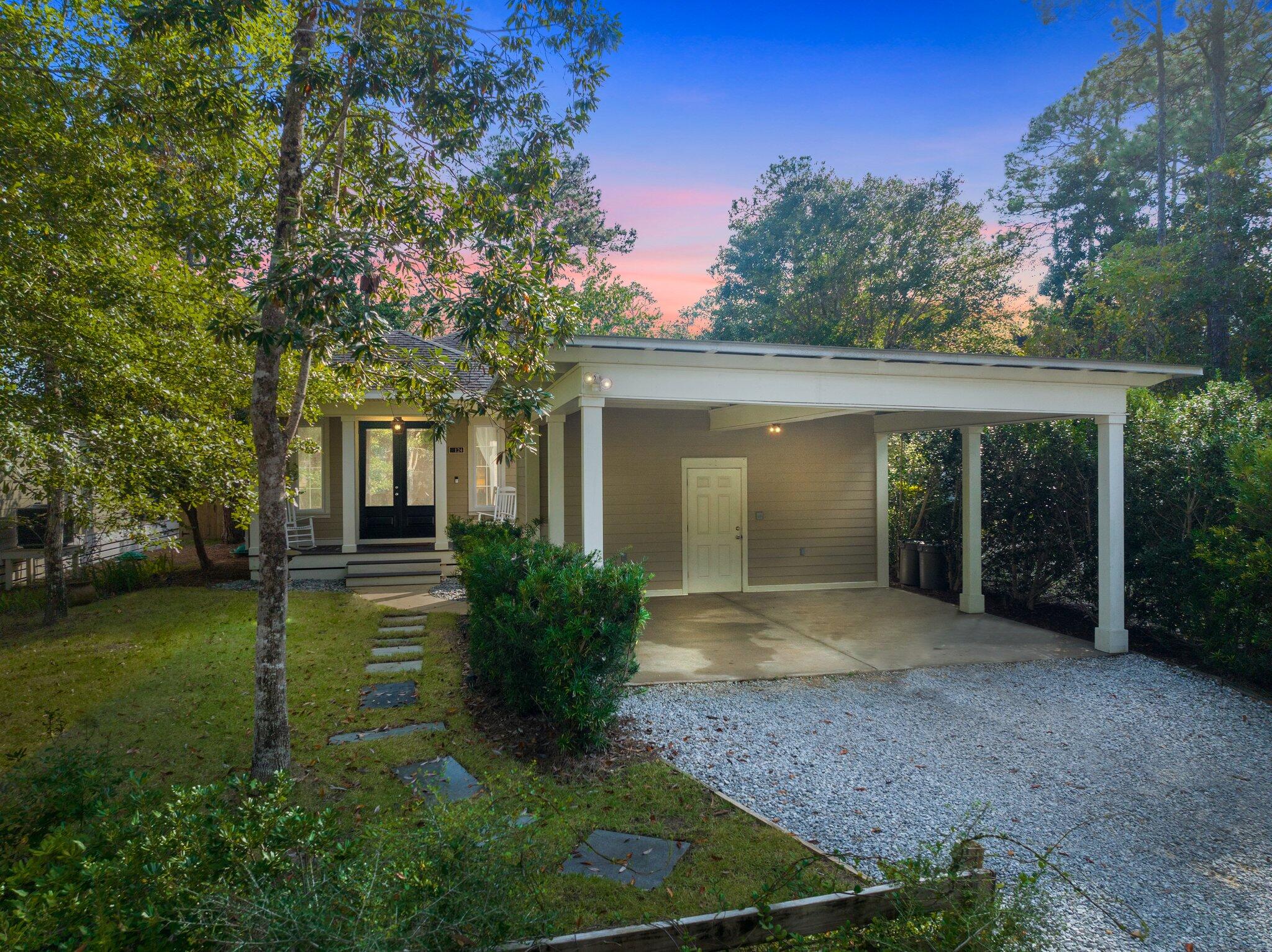 124 East Wild Blueberry Way Santa Rosa Beach, FL 32459 - Photo 4 of 38 front view of a house with a garden
