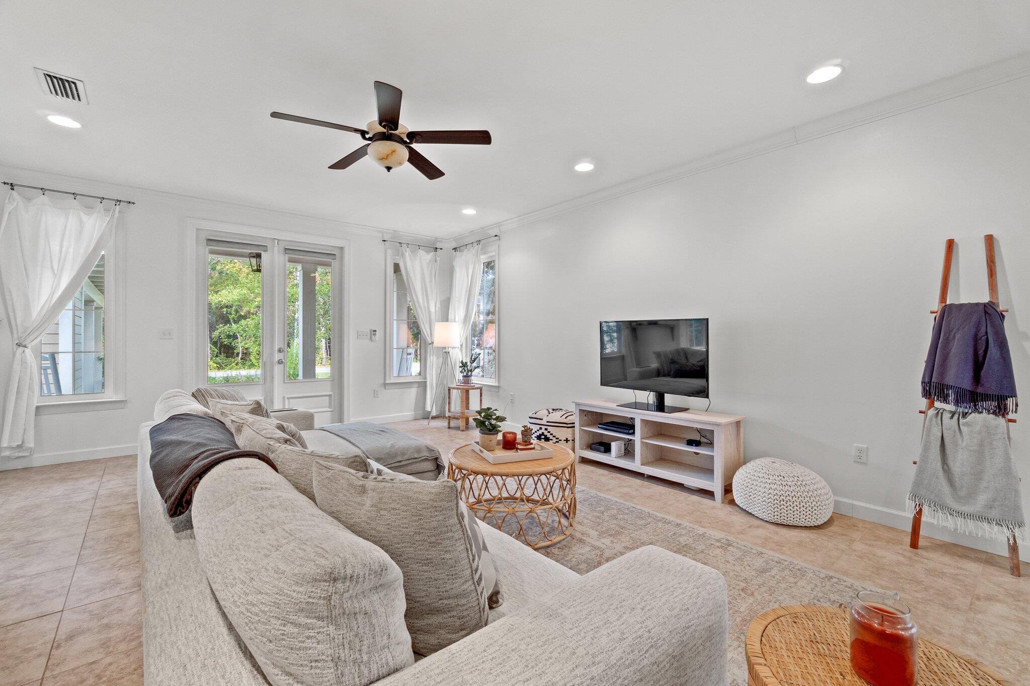 124 East Wild Blueberry Way Santa Rosa Beach, FL 32459 - Photo 7 of 38 a living room with furniture and a flat screen tv
