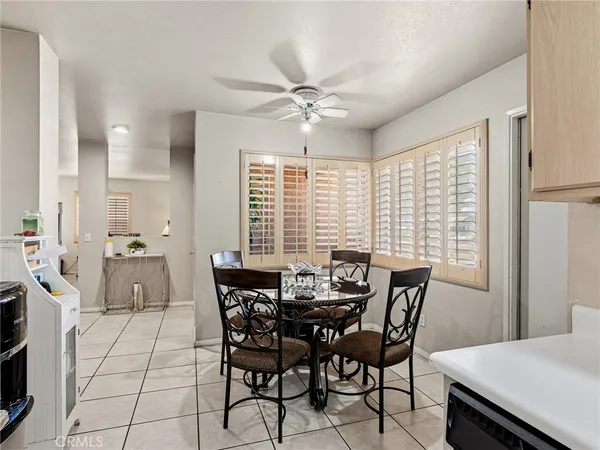 a view of a dining room with furniture and window