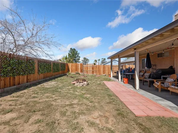 a view of a backyard of the house
