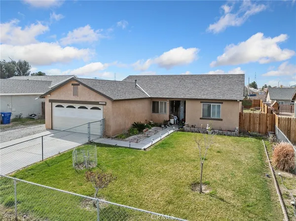 a view of a house with basketball court
