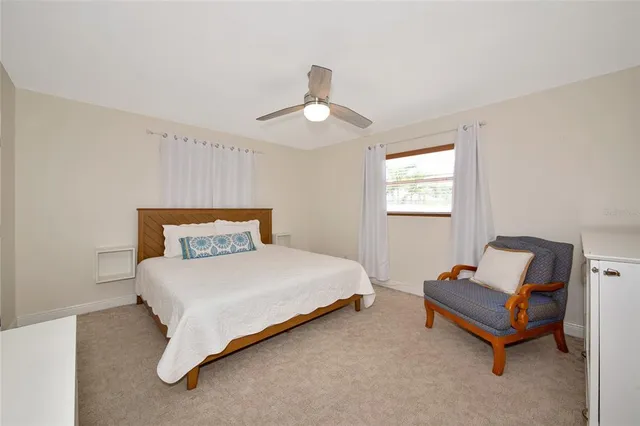 a bedroom with a bed and window