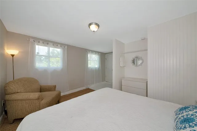 a bedroom with a bed and window