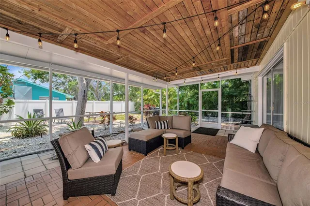 a outdoor space with patio the couches and a dining table with garden view