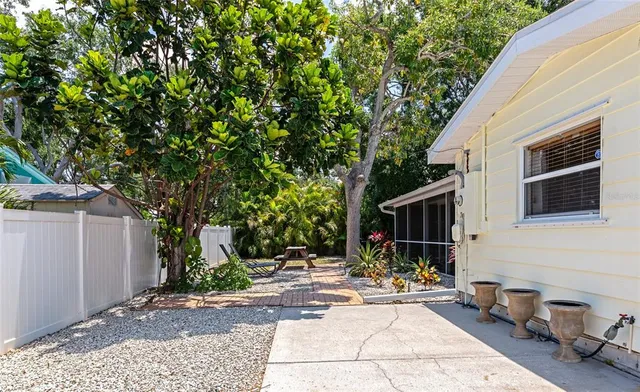 a view of a backyard with sitting area