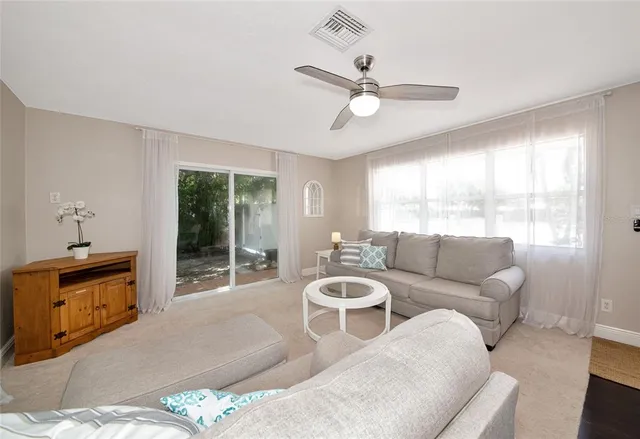 a living room with furniture and a window
