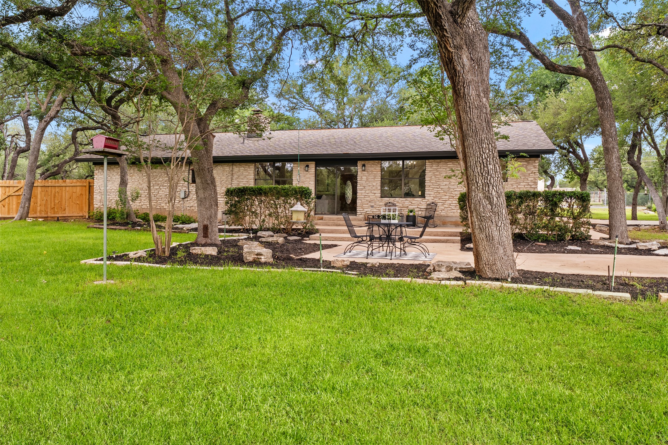 303 West Sequoia Spur Georgetown, TX 78628 - Photo 5 of 34 a backyard of a house with table and chairs