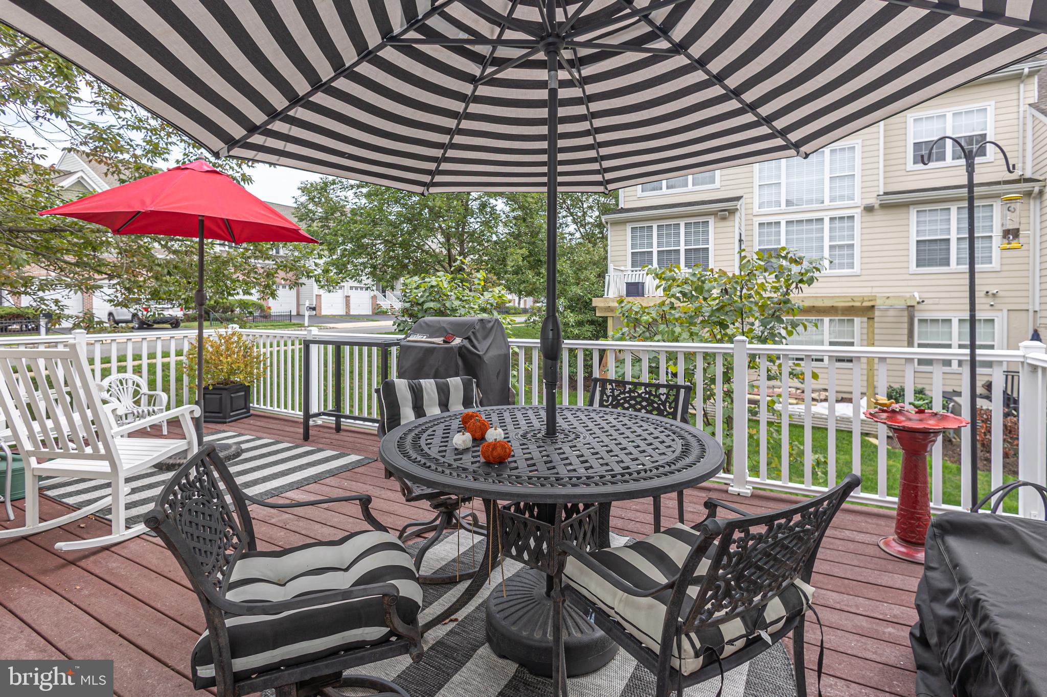 501 Titus Road Lambertville, NJ 08530 - Photo 32 of 62 a view of a patio with a table chairs and a umbrella