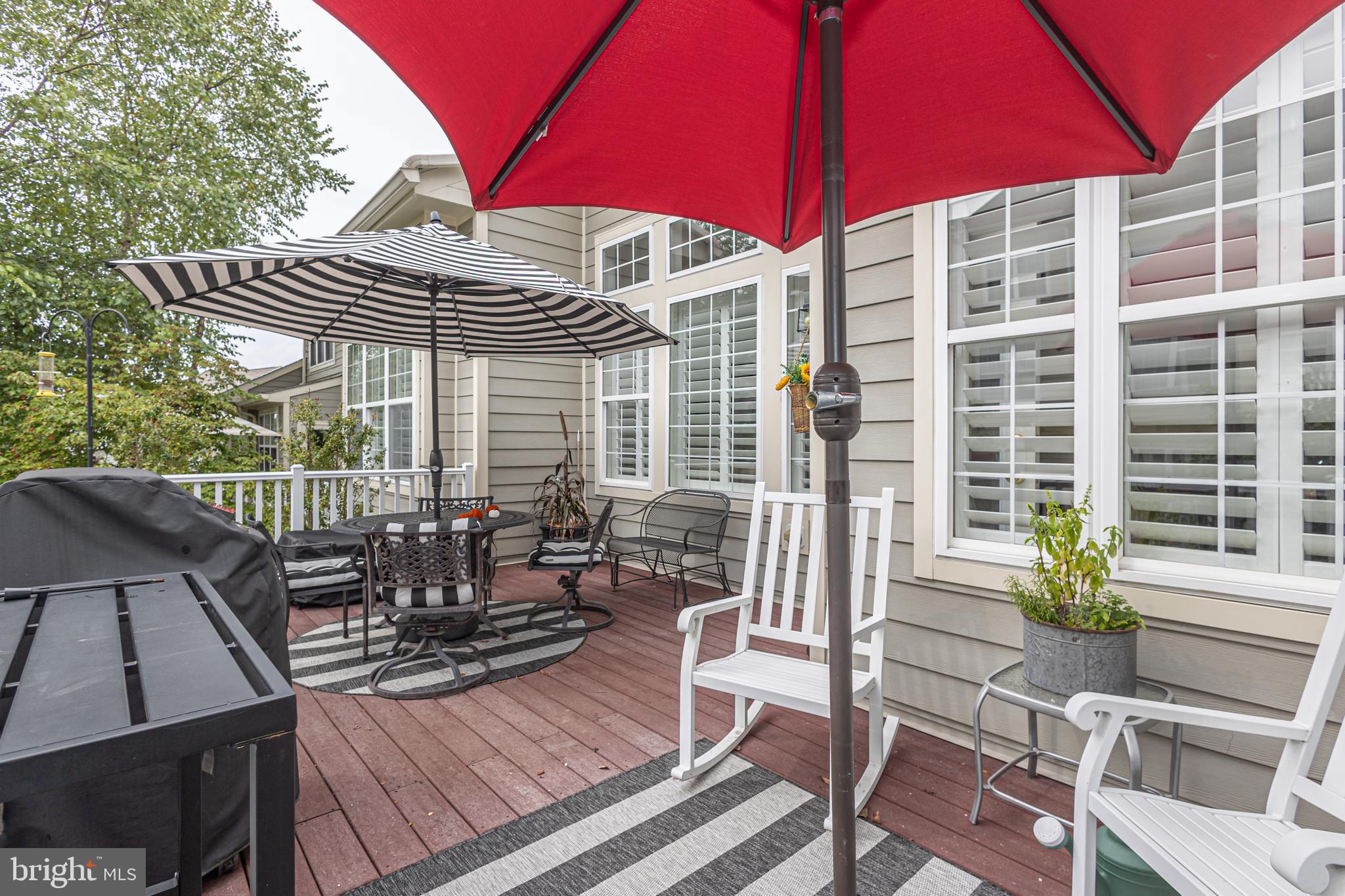 501 Titus Road Lambertville, NJ 08530 - Photo 33 of 62 a view of a patio with table and chairs under an umbrella