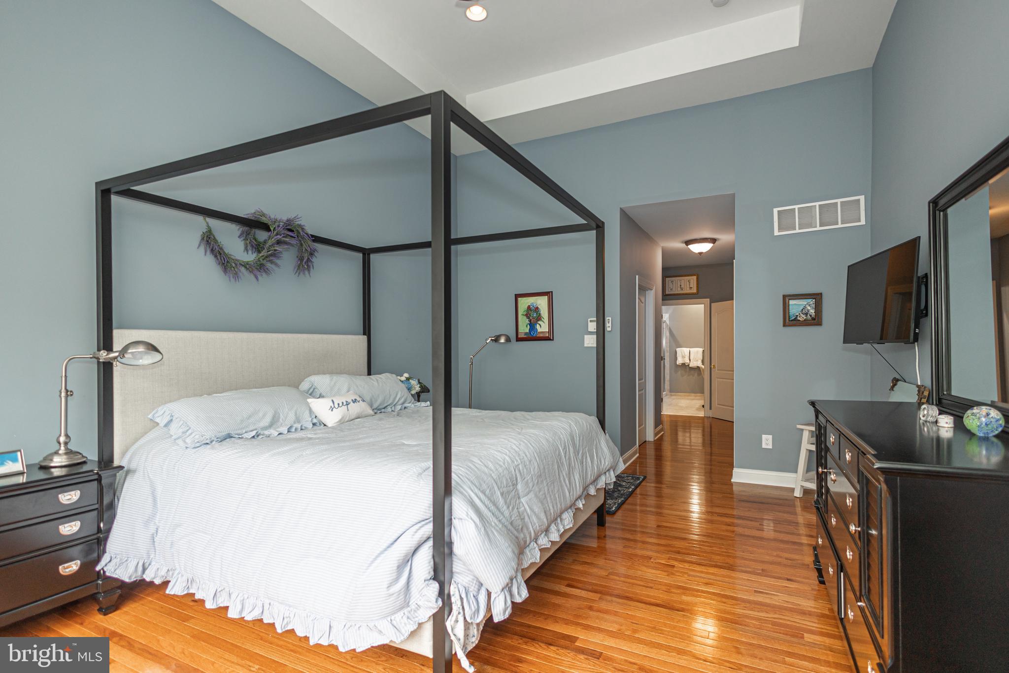 501 Titus Road Lambertville, NJ 08530 - Photo 37 of 62 a bedroom with a bed and a flat screen tv