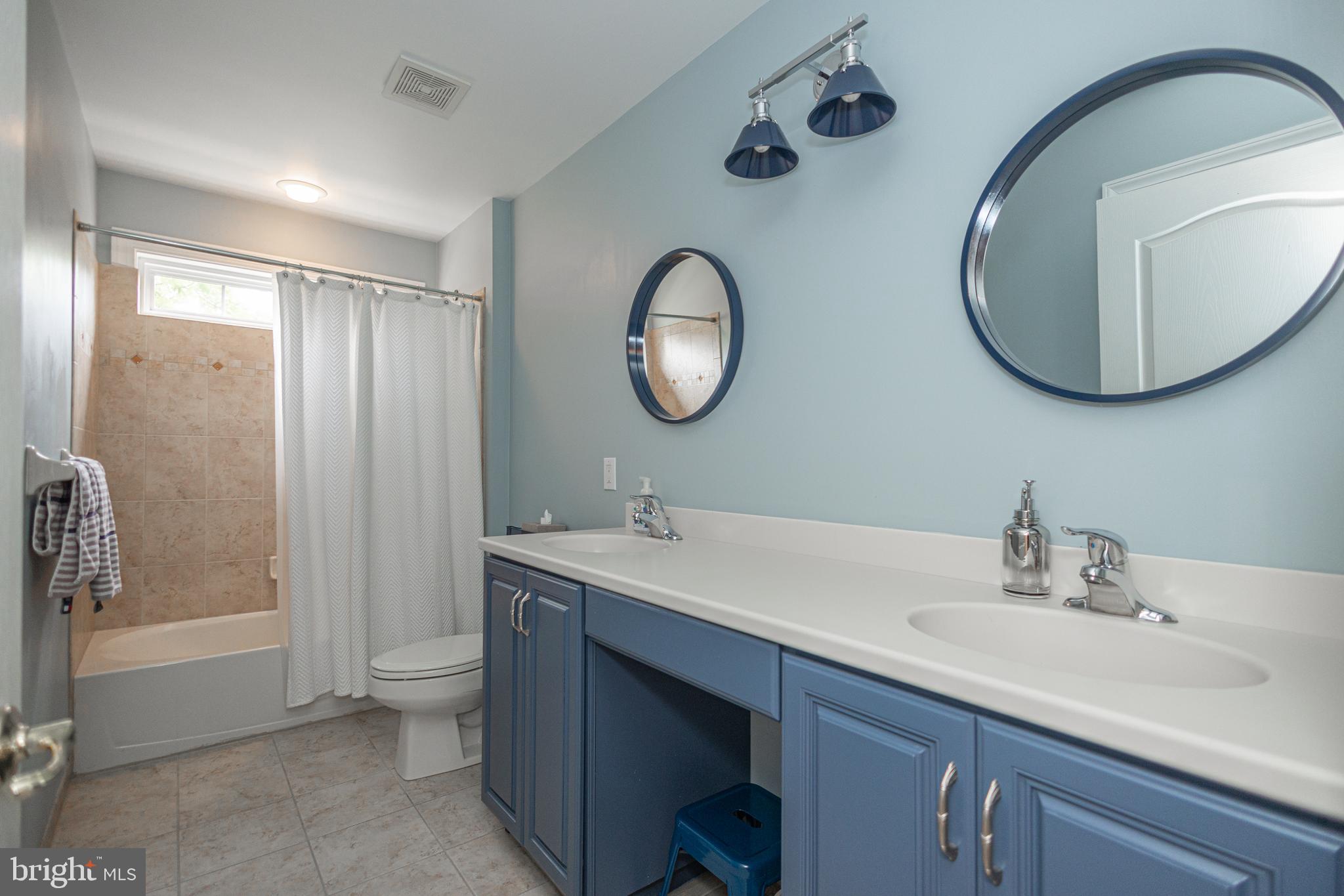 501 Titus Road Lambertville, NJ 08530 - Photo 44 of 62 a bathroom with a double vanity sink mirror and bathtub