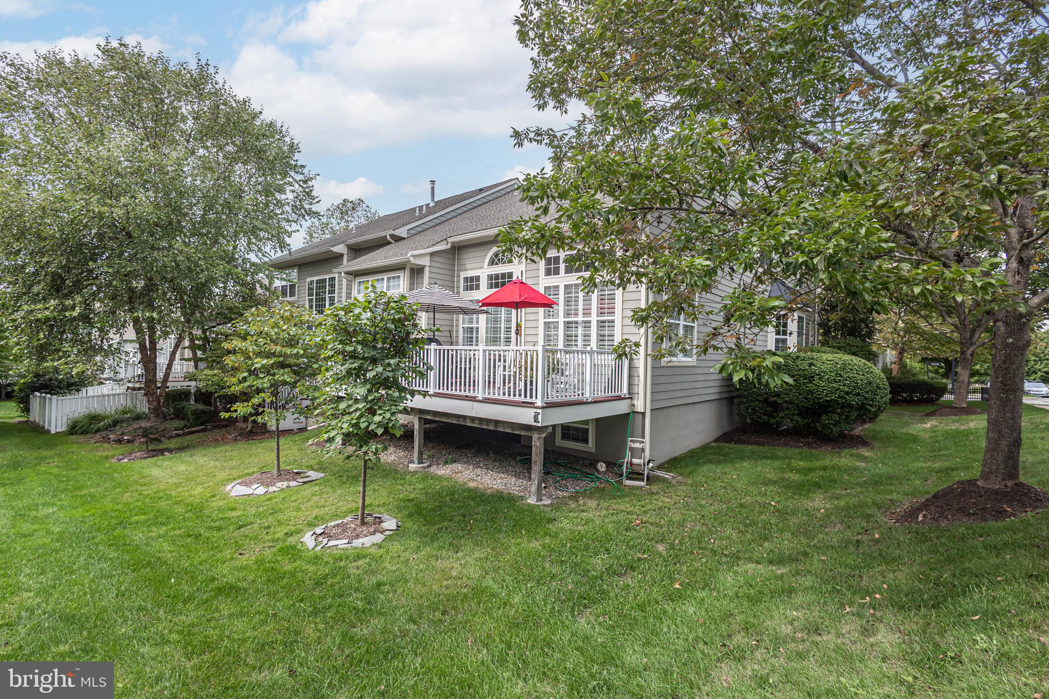 501 Titus Road Lambertville, NJ 08530 - Photo 6 of 62 a view of a chair and table in backyard of the house