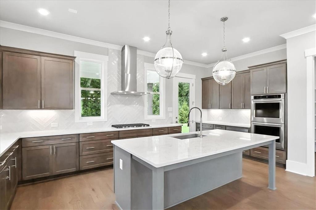 95 Old Town Road Dacula, GA 30019 - Photo 24 of 74 a large kitchen with kitchen island a sink a stove and a refrigerator