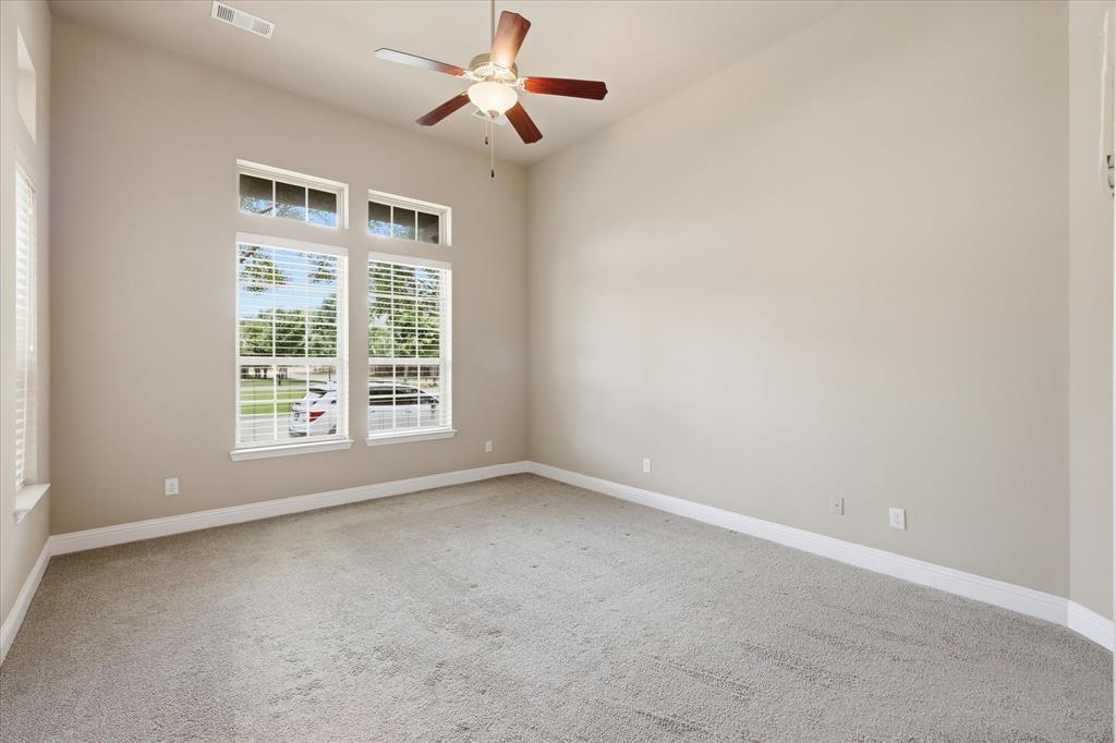768 Huntingdon Street Coppell, TX 75019 - Photo 7 of 37 Spacious bedroom with high ceilings, soft carpet, ceiling fan, and tall windows that bring in wonderful natural light.