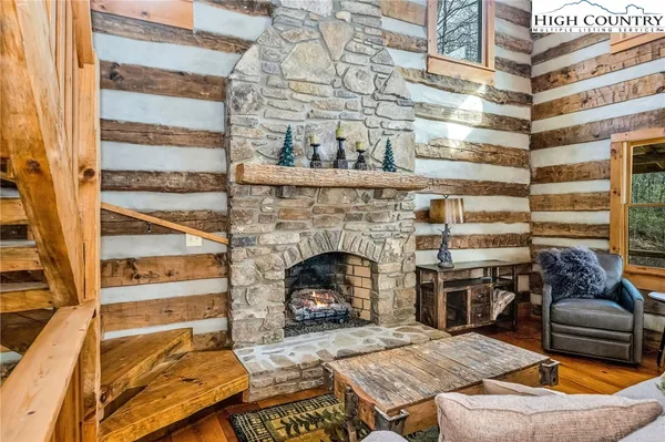 a spacious bedroom with a large bed and a wooden floors