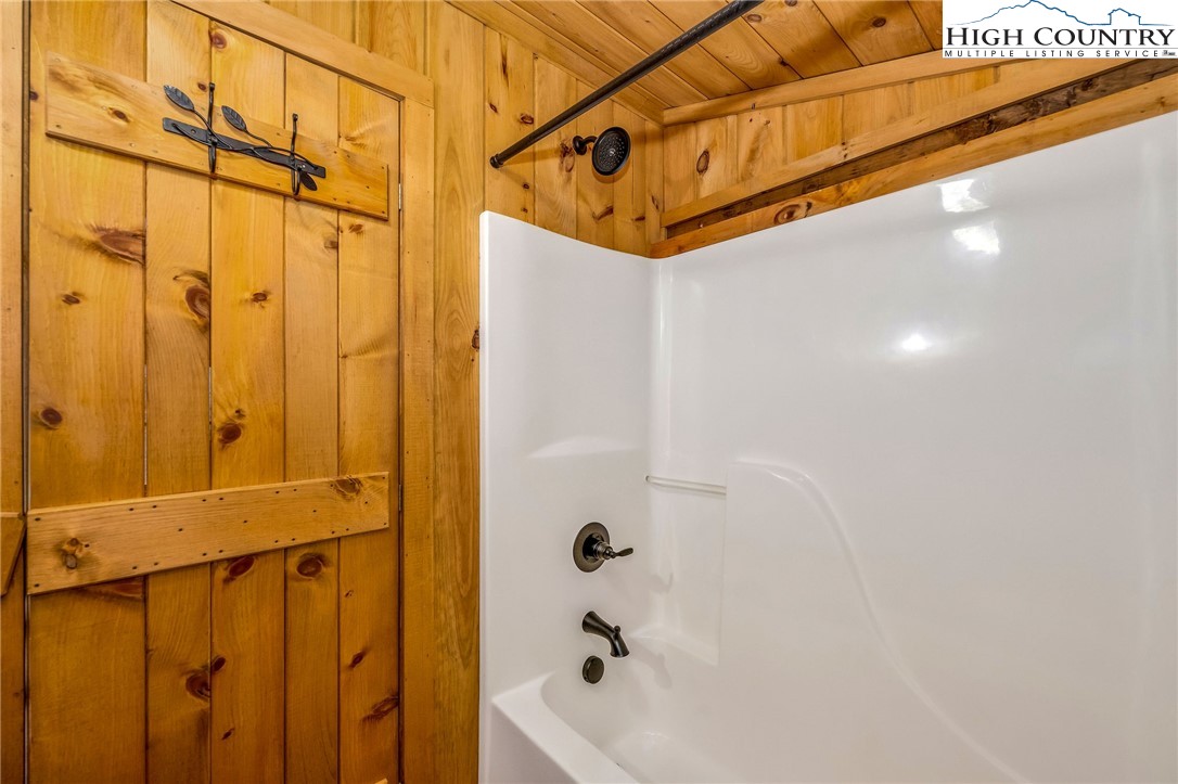 372 Homestead Road Todd, NC 28684 - Photo 35 of 41 a bathroom with a shower and a bathtub