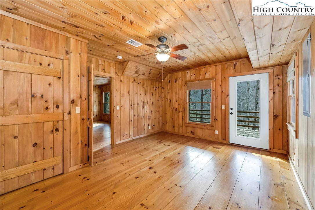 372 Homestead Road Todd, NC 28684 - Photo 39 of 41 a view of a hallway with wooden floor