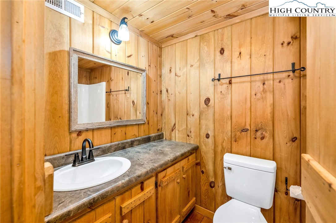 372 Homestead Road Todd, NC 28684 - Photo 40 of 41 a bathroom with a granite countertop sink toilet and shower