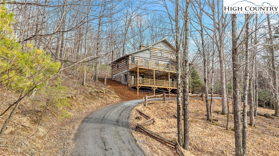 372 Homestead Road Todd, NC 28684 - Photo 4 of 41 a view of a yard with staircase