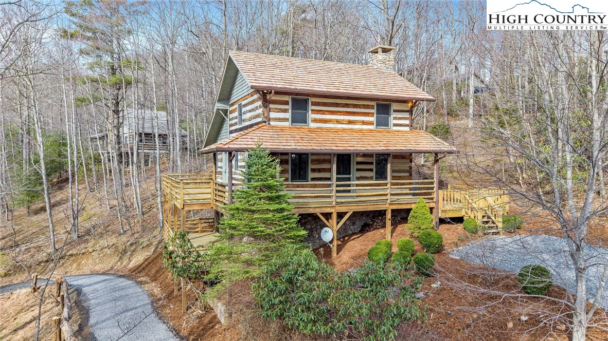 372 Homestead Road Todd, NC 28684 - Photo 7 of 41 a front view of a house with a yard