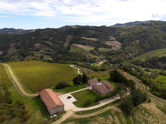 an aerial view of a house with a garden