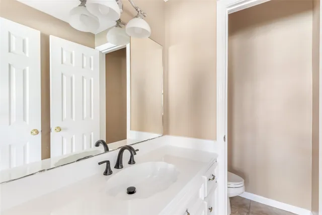 a view of a bedroom with wooden floor