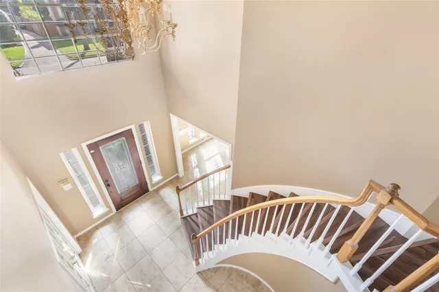 a view of a kitchen with a sink and a refrigerator