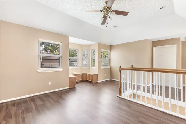 a white toilet sitting next to a bathroom sink