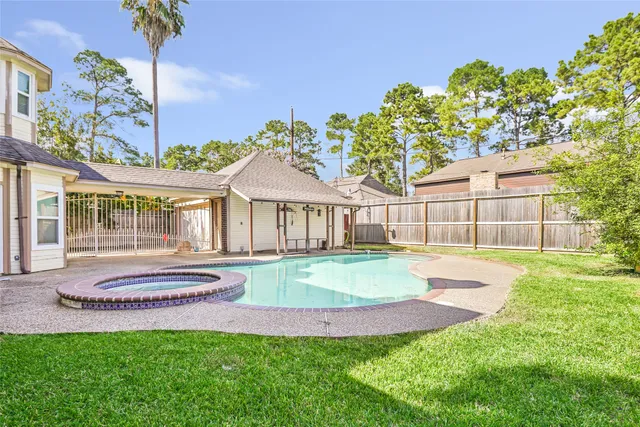 a front view of a house with a porch and a yard