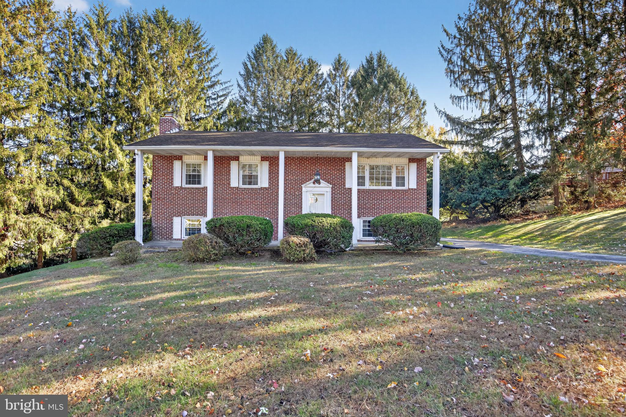 1901 Suffolk Road Finksburg, MD 21048 - Photo 1 of 35 a view of a house with a yard and large tree
