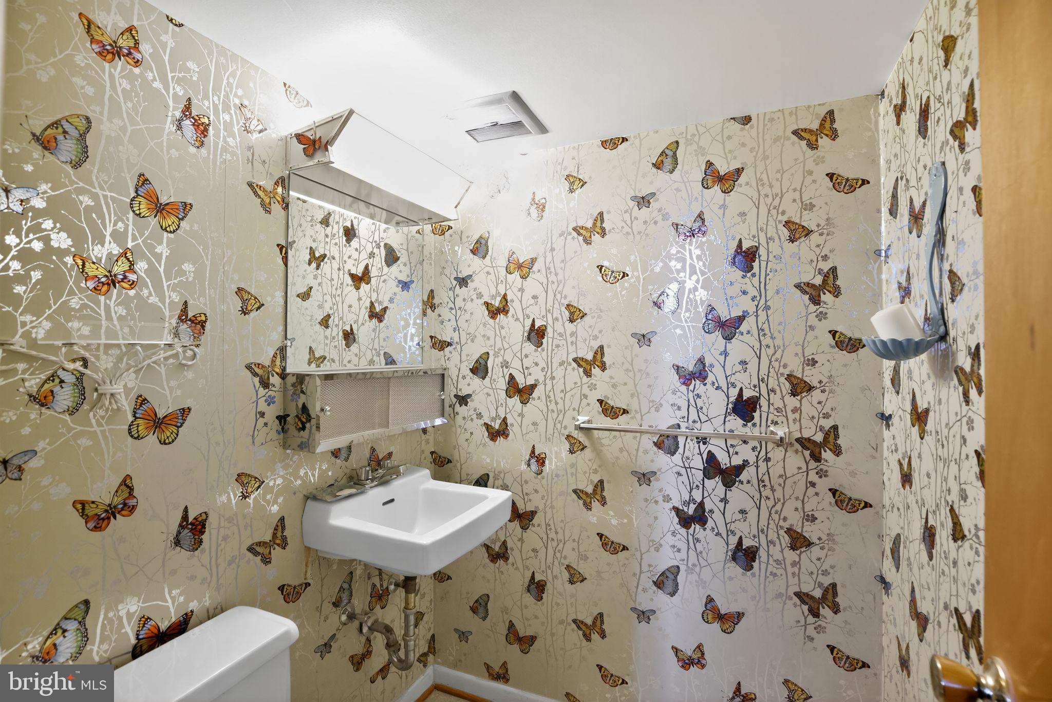 1901 Suffolk Road Finksburg, MD 21048 - Photo 31 of 35 a bathroom with a sink a toilet and shower curtain